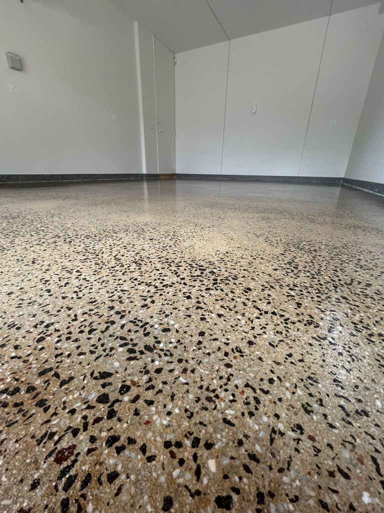 Grind-and-seal concrete floor with exposed aggregate and high-gloss topical sealer by Claraseal Melbourne