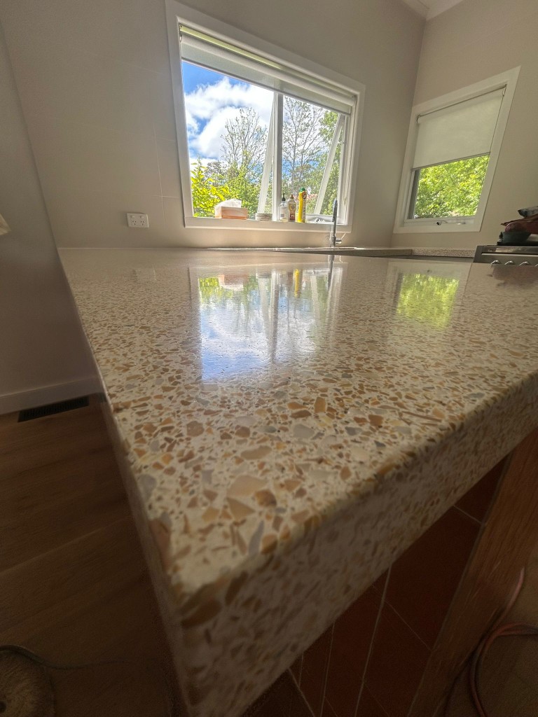 Polished terrazzo benchtop with golden aggregate by Claraseal Melbourne