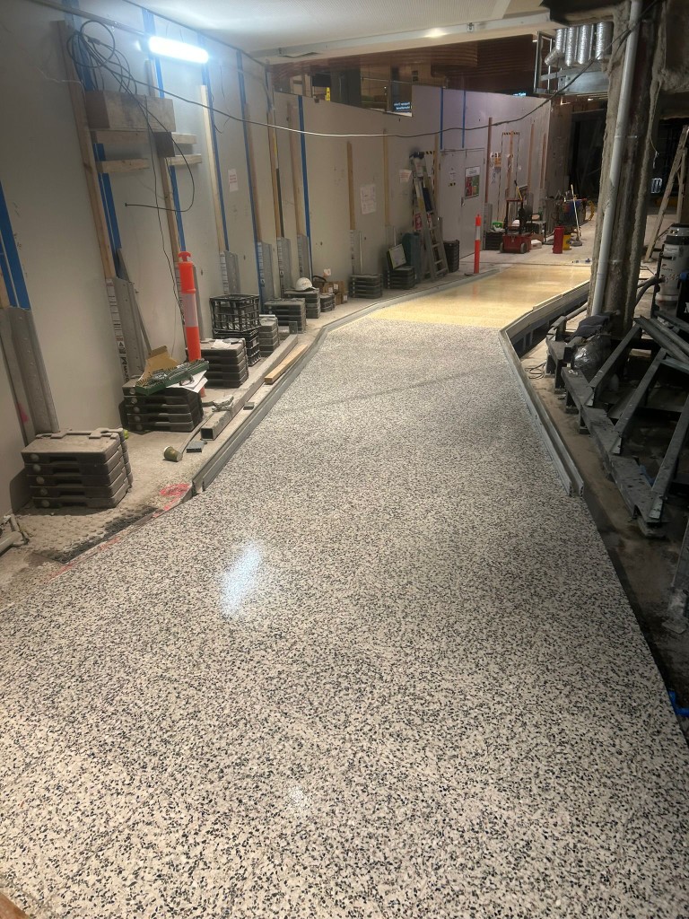 Epoxy flake floor installed during commercial fit-out